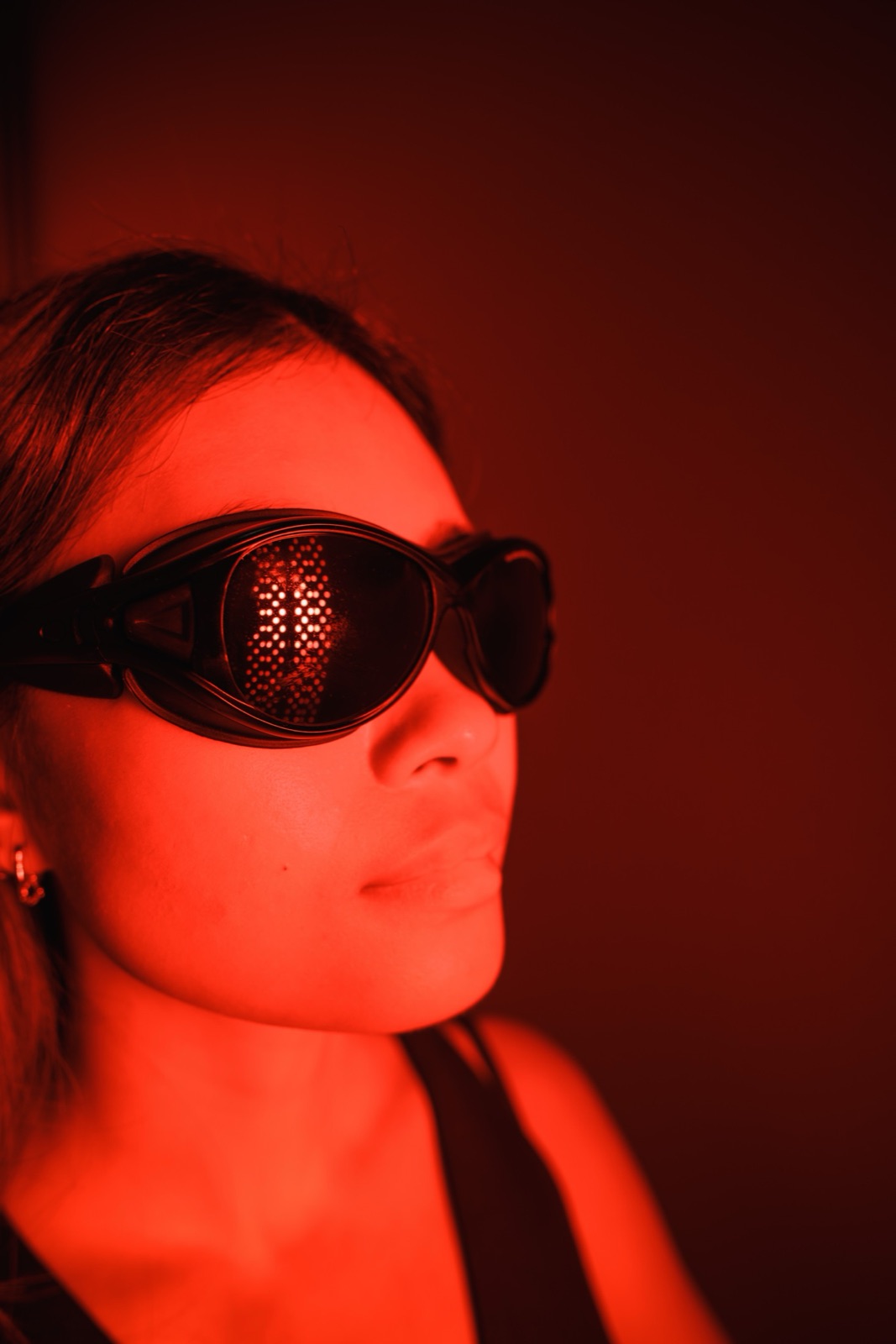 Protective eyewear worn during a red light session